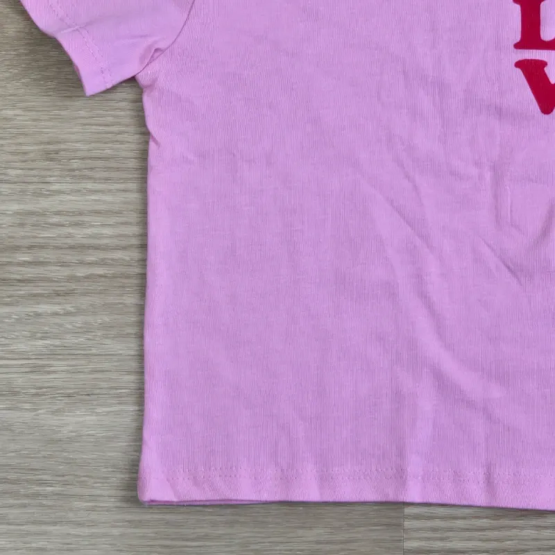 Pulover color rosado con Love