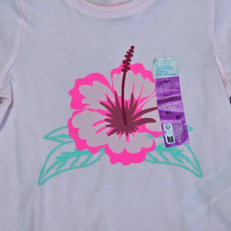 Pulóver con flor en el centro color rosado