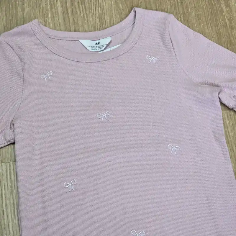 Pulover de Canalé Rosado con lazos perlados