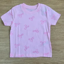 Pulover rosado de lazos