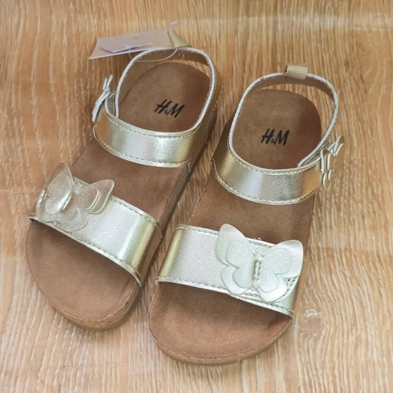 Sandalias de pegueta doradas de mariposa