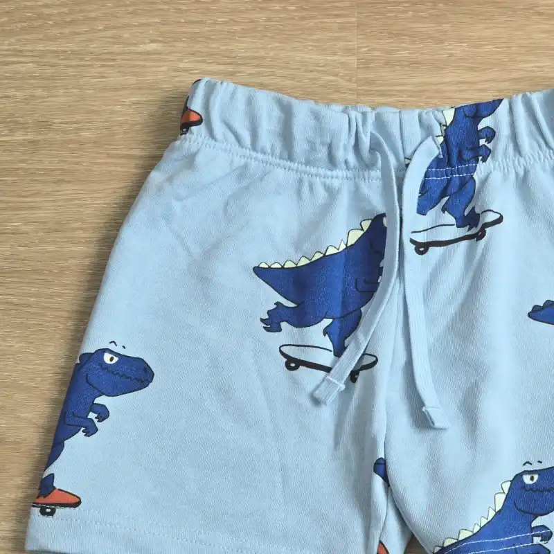Short de felpa azul con Dinosaurios