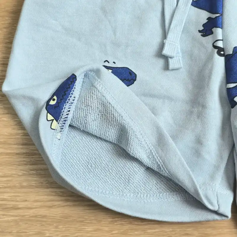Short de felpa azul con Dinosaurios