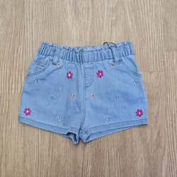 Short niña de mezclilla con flores de colores