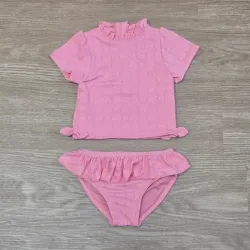 Traje de baño rosado con blusa con detalle de lazos
