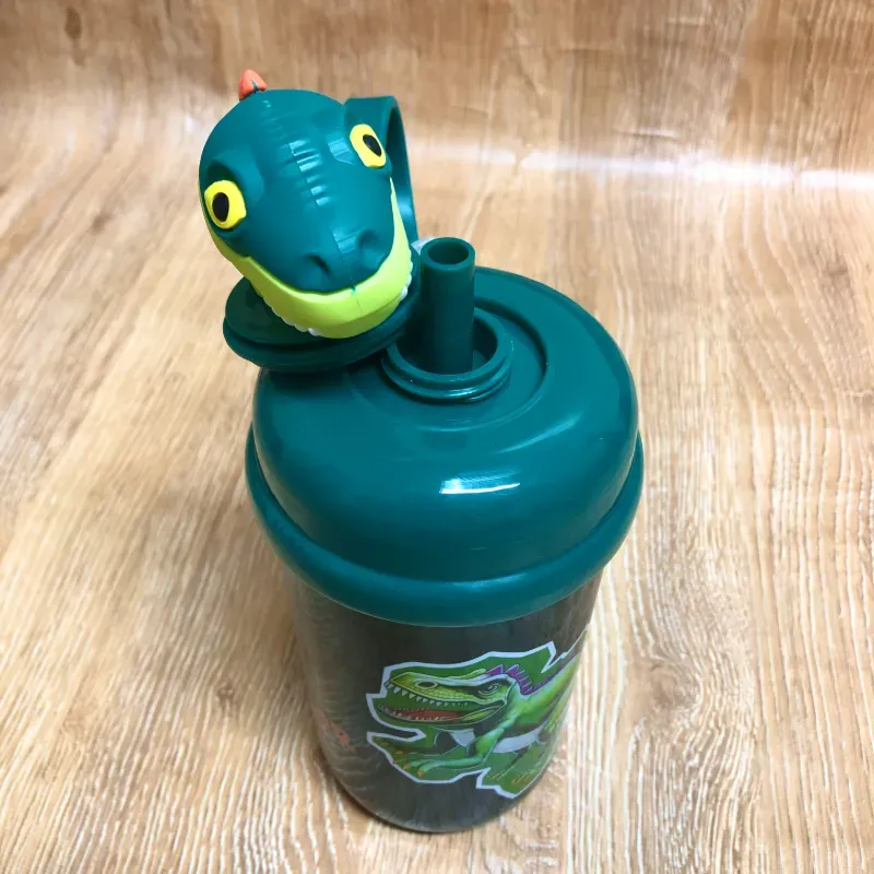 Pomo con dinosaurio 