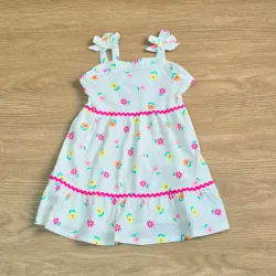 Vestido color blanco con flores coloridas con lazos