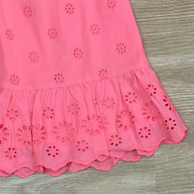 Vestido con vuelos y bordados color naranja