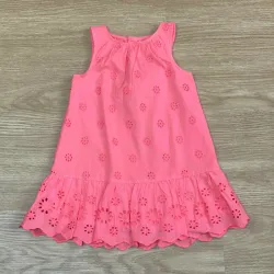 Vestido con vuelos y bordados color naranja