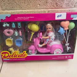 Mono Barbie motorista con accesorios