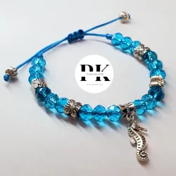 PULSERA DE SWAROVSKI AZUL CON DIJE DE CABALLITO DE MAR