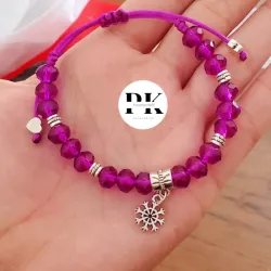 PULSERA DE SWAROVSKI MORADO CON DIJE DE COPO DE NIEVE