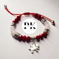 PULSERA DE SWAROVSKI ROJO Y BLANCO CON DIJE DE LEÓN