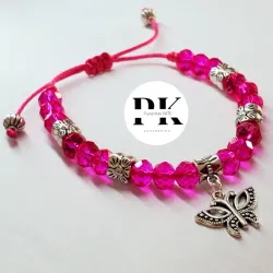 PULSERA DE SWAROVSKI ROSADO CON DIJE DE MARIPOSA