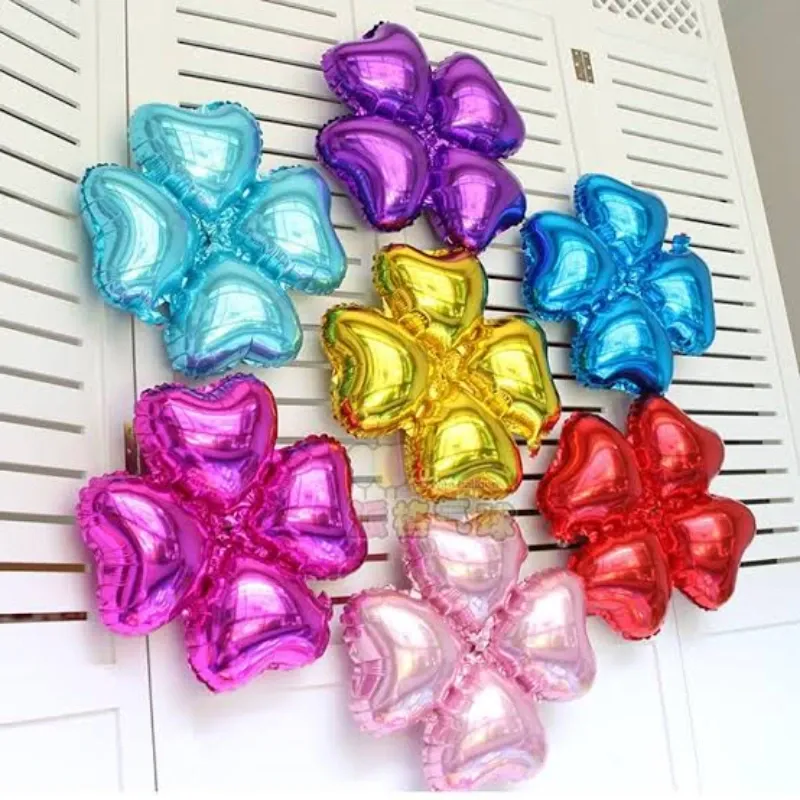 GLOBO MET 16" FLOR 4 PETALOS DE CORAZON DORADO