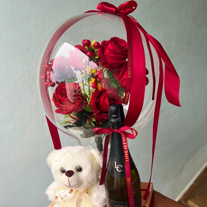 Caja con botellas y oso 