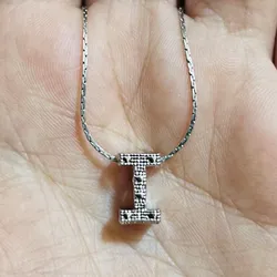 Charms en forma de letra