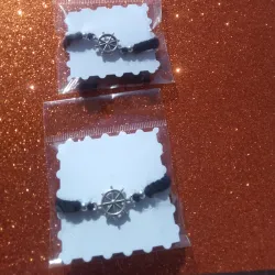 Pulseras con dije de timón