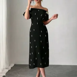 Vestido negro de perlas y lazos. Talla M