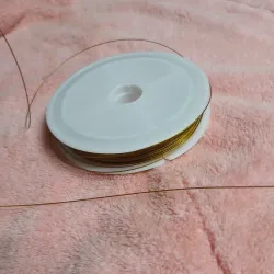 Alambre por metro plastificado dorado 0.45 mm