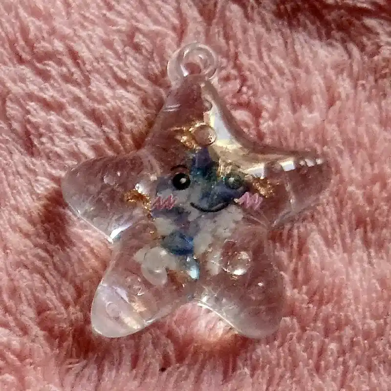 Dije figura fluorescente de resina estrella