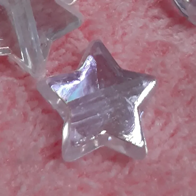 Estrella chica blanca y rosa transparente tornasol