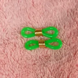 Gomas de espejuelos verde con herraje dorado